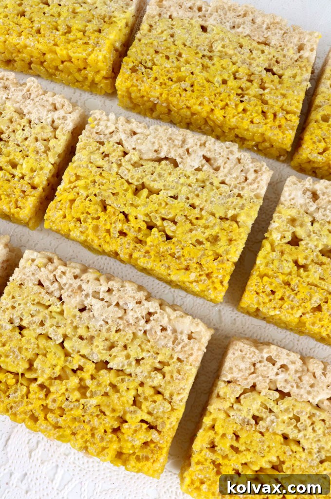 Close-up of a stack of Sunshine Rice Krispie Treats with a beautiful yellow gradient