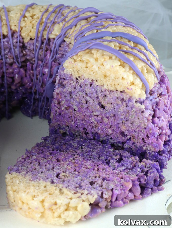 Ombre Rice Krispie Cake - This close-up view reveals the intricate beauty of the ombre layers within the Rice Krispie Cake. A truly gorgeous, delicious, and unique dessert, guaranteed to impress and delight at any gathering. Pin for later and explore more delightful Rice Krispie Treat recipes with us.
