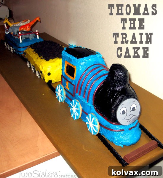 Delightful Thomas the Train birthday cake, a vibrant blue engine with companion cars, perfect for a child's birthday celebration.