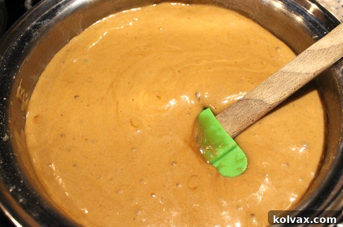 Adding baking soda to the caramel mixture