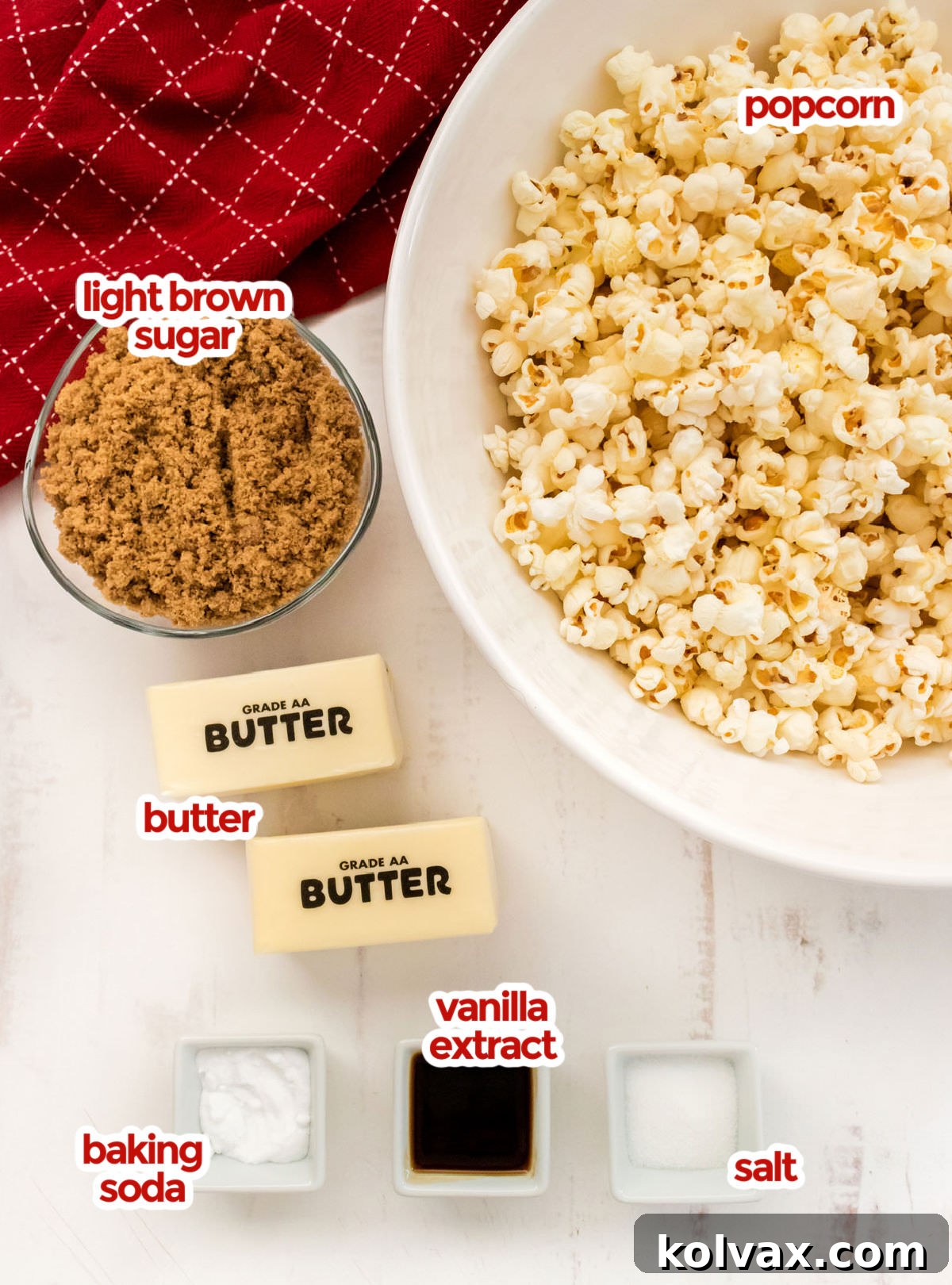 All the ingredients you will need to make Easy Homemade Caramel Corn including popcorn, butter, brown sugar, vanilla extract, salt and baking soda.