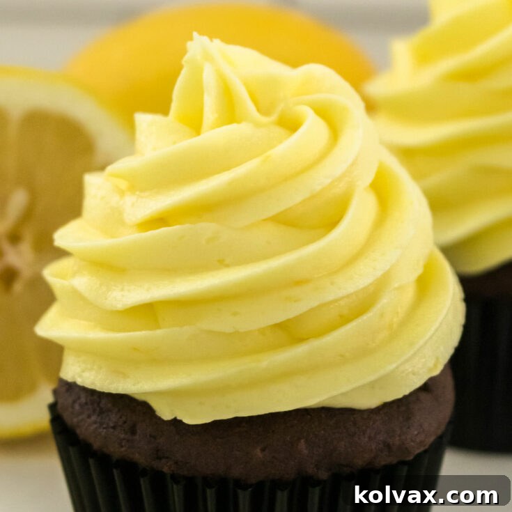 A beautifully frosted cupcake with The Best Lemon Buttercream Frosting, highlighting the recipe.