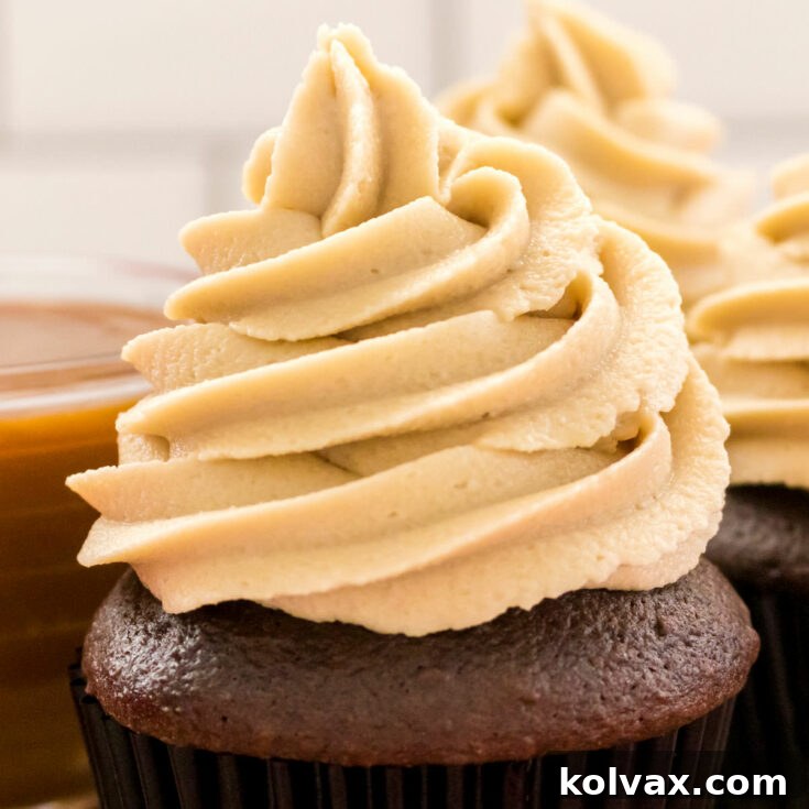 The Best Caramel Buttercream Frosting, a close-up of a beautifully frosted cupcake.