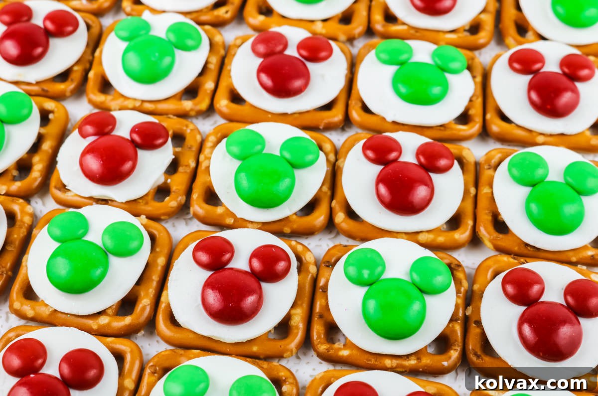 Festive Mickey Pretzel Delights 2 Closeup on rows of Green and Red Christmas Mickey Mouse Pretzel Bites, showcasing their festive colors and cute Mickey shape.