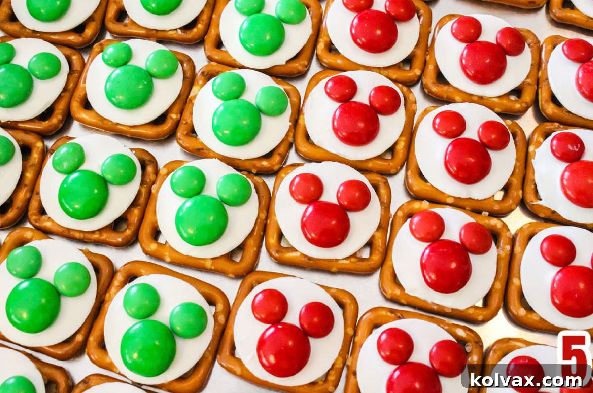 Festive Mickey Pretzel Delights 4 Overhead shot of rows of Red and Green Christmas Mickey Mouse Pretzel Bites, ready for a festive gathering.