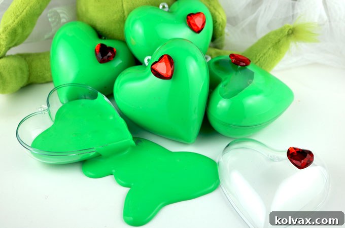 Our Grinch Slime - fun and colorful homemade GAK that would be great as a Christmas Stocking Stuffer or a Holiday Party Favor. We have step by step directions on how to make this easy to make DIY Christmas Craft. The kids will love playing with this ooey, gooey Holiday sensory activity. Follow us for more fun Christmas DIY Gifts.