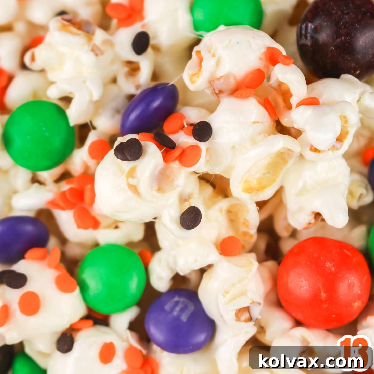 Closeup on the candy mix-ins added to the Halloween Marshmallow Popcorn.