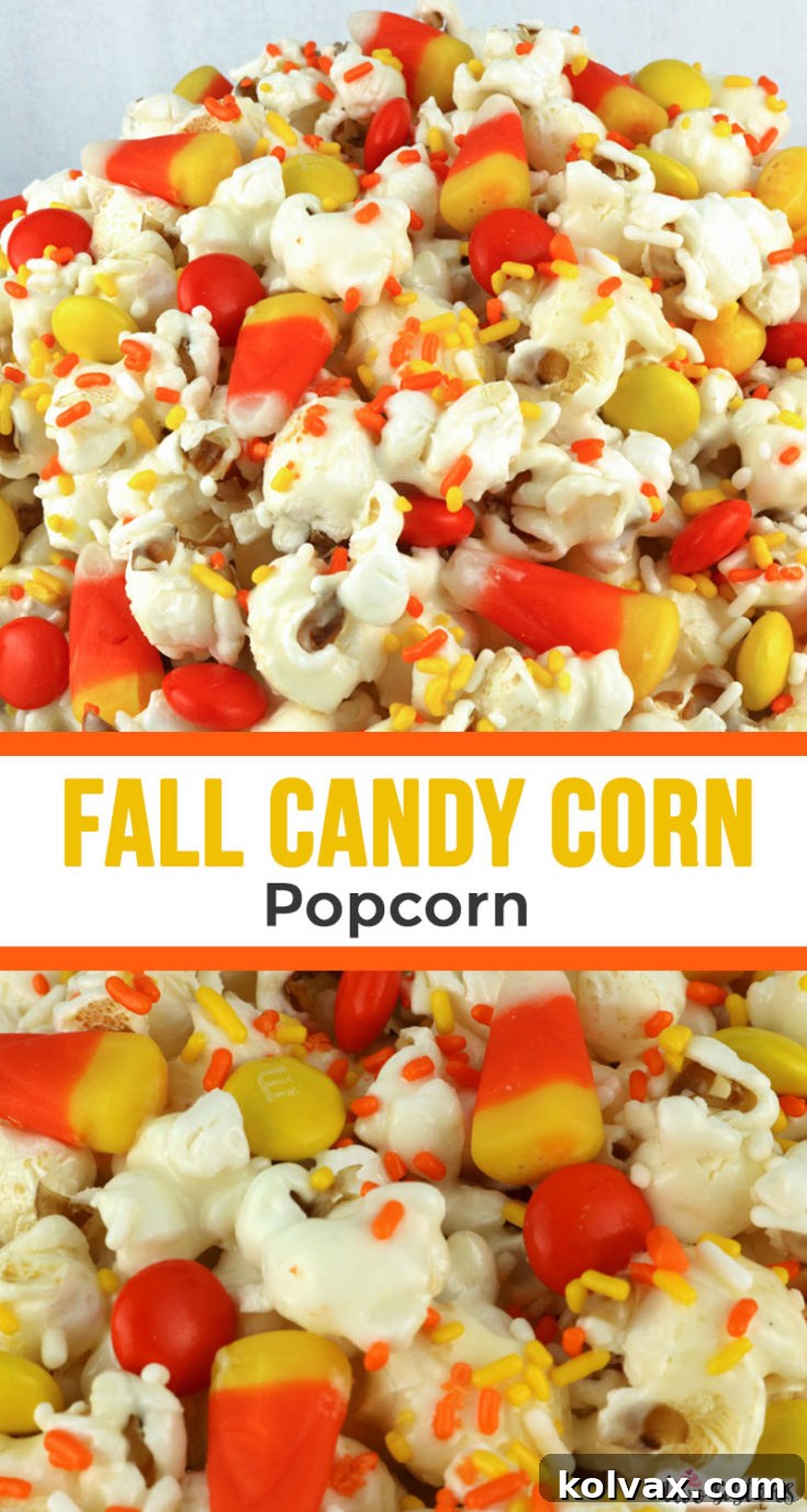Fall Candy Corn Popcorn in a white bowl with additional candy corn scattered around.