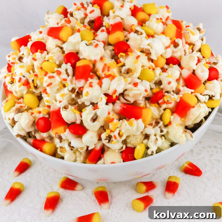 Fall Candy Corn Popcorn, presented in a festive Halloween setting.