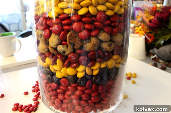 Adding a layer of Mini Chips Ahoy cookies to the Thanksgiving Candy Centerpiece for texture