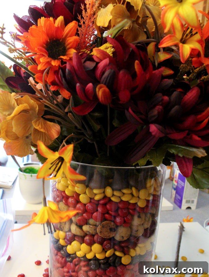 Finishing the candy layers with Hershey's Kisses in the Thanksgiving Centerpiece