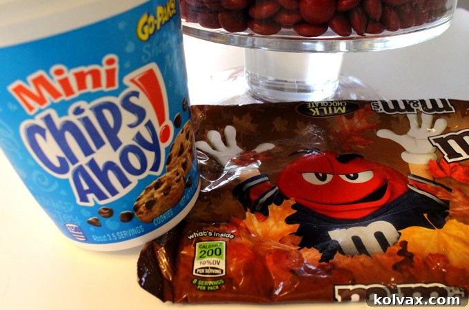 Ingredients for a Thanksgiving Candy Centerpiece featuring M&M's, Peeps, cookies, and vases
