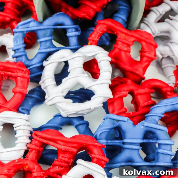 A large batch of New England Patriots themed pretzels laying randomly on a white table, ready for serving or gifting.