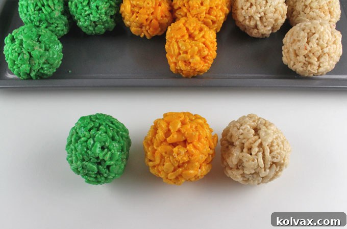 Two Sisters Green Bay Packers Rice Krispie Bites ready for a football party, showcasing the vibrant green, gold, and white colors.