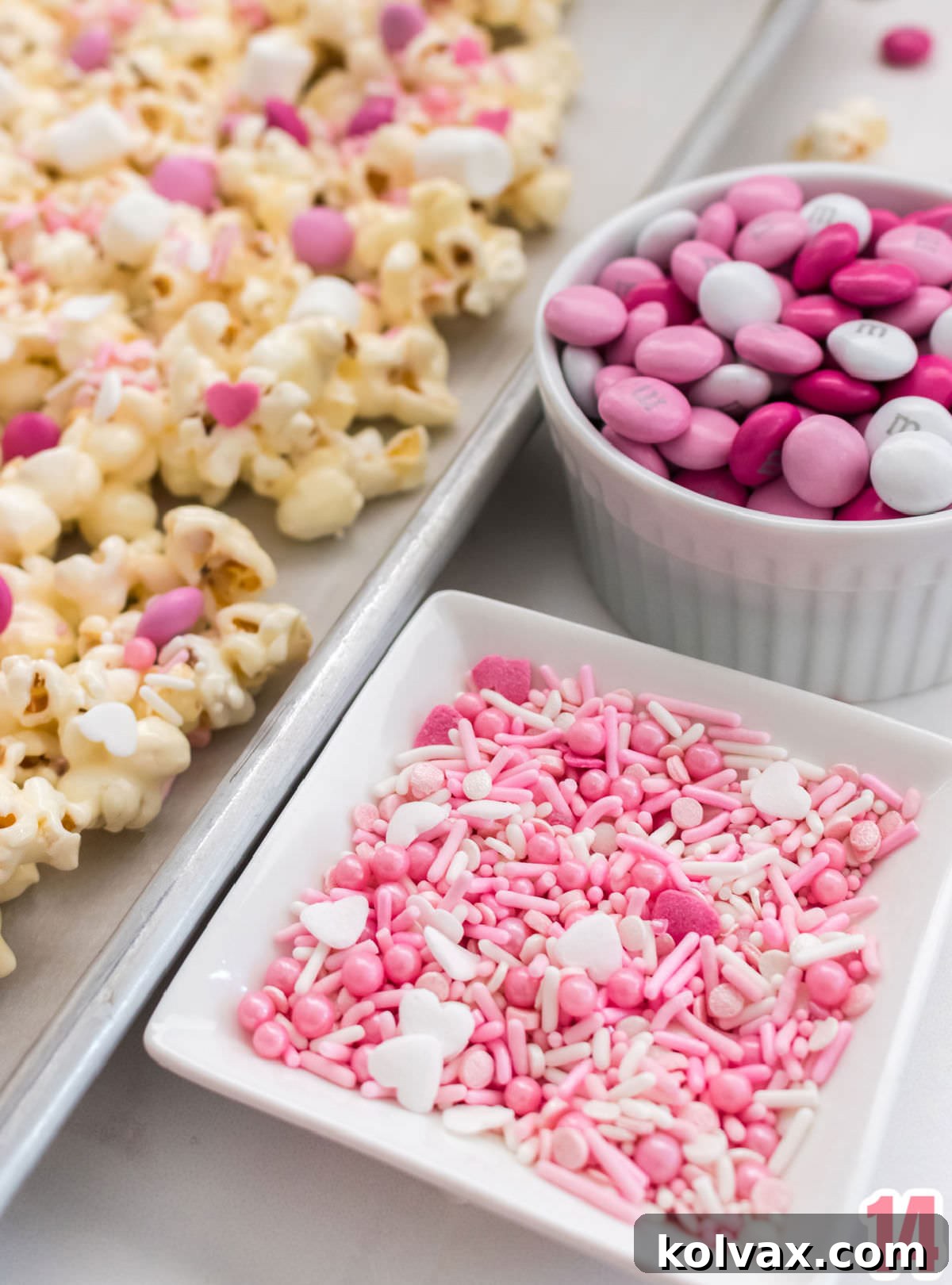 Close up of the pink sprinkles mix and the Valentine's mix M&M's used in the Pretty Pink Party Popcorn.