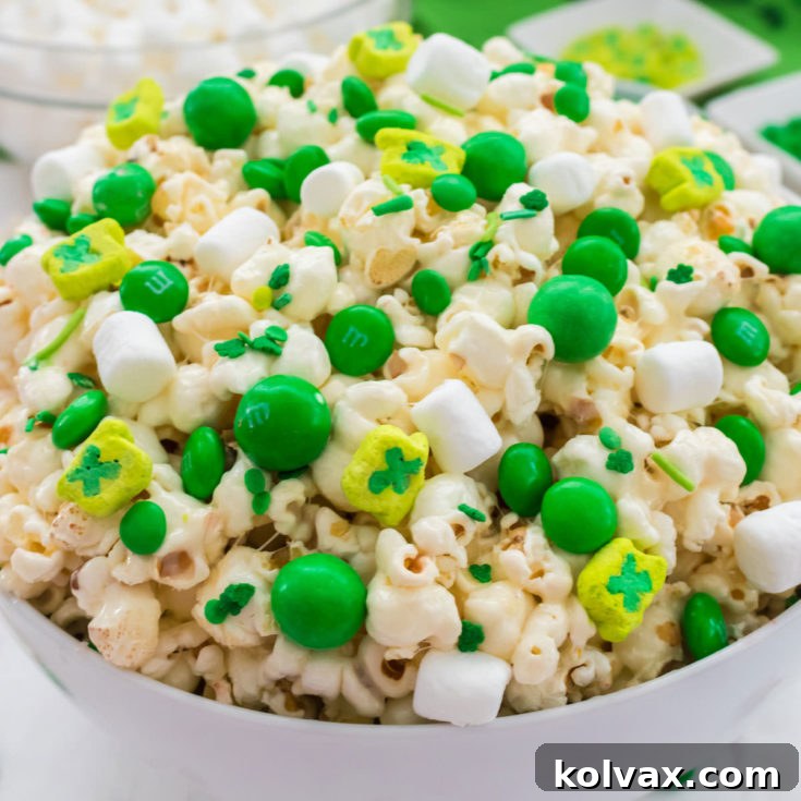 St. Patrick's Day Popcorn - a fun St. Patrick's Day treat. Sweet, salty, crunchy and delicious and it is so easy to make. You won't need the luck of the Irish to make this easy St. Patrick's Day dessert. Pin this great Popcorn recipe for later and follow us for more fun St. Patrick's Day Food ideas.