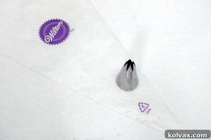 Preparing your piping bag with an open star tip for classic cupcake frosting swirls