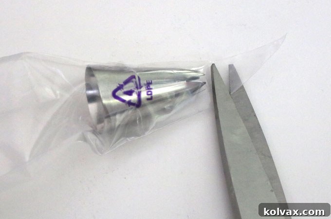 Properly inserting the decorating tip into the piping bag for successful cupcake frosting