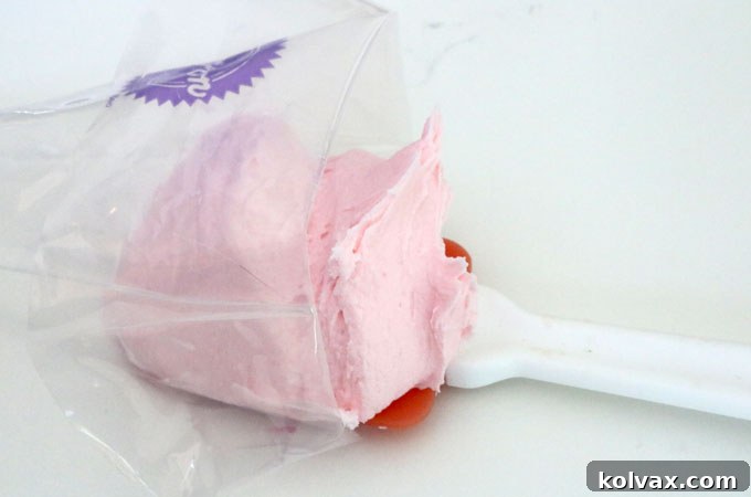 Folding the piping bag to create a stable opening for mess-free frosting transfer