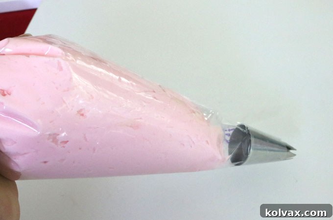 Gathering and securing the top of the piping bag to prevent frosting from escaping