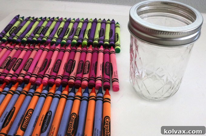 Sorting crayons by color for a DIY Mason jar teacher gift project
