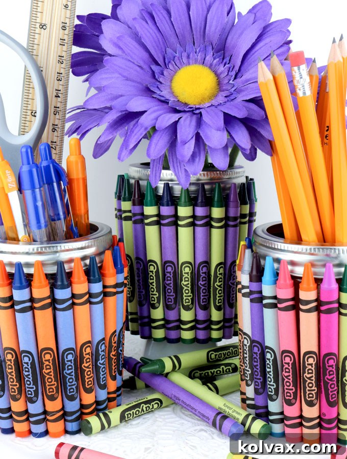 Finished Crayon Mason Jar Teacher Gift filled with a variety of colorful school supplies