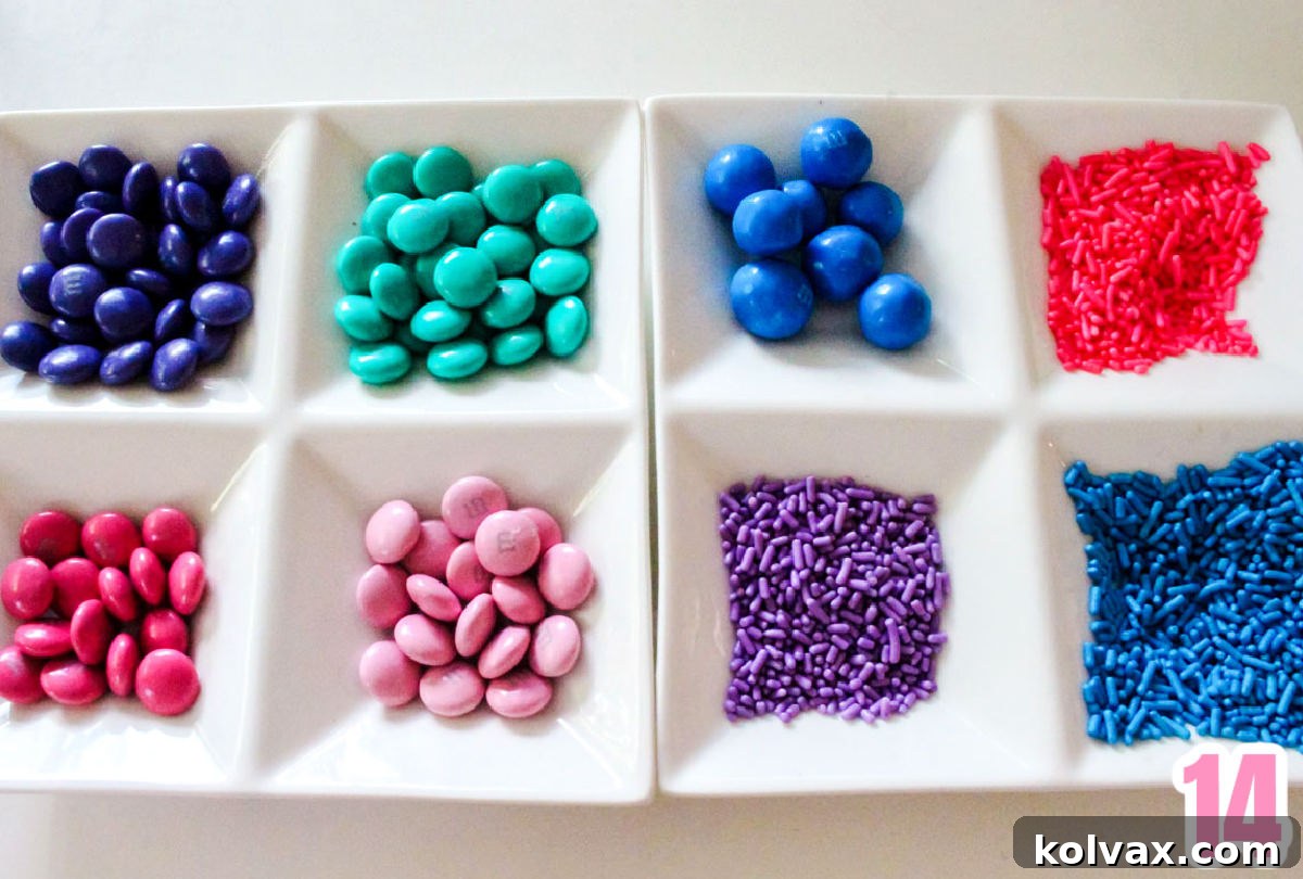 Two white candy dishes filled with colorful M&M's and sprinkles.