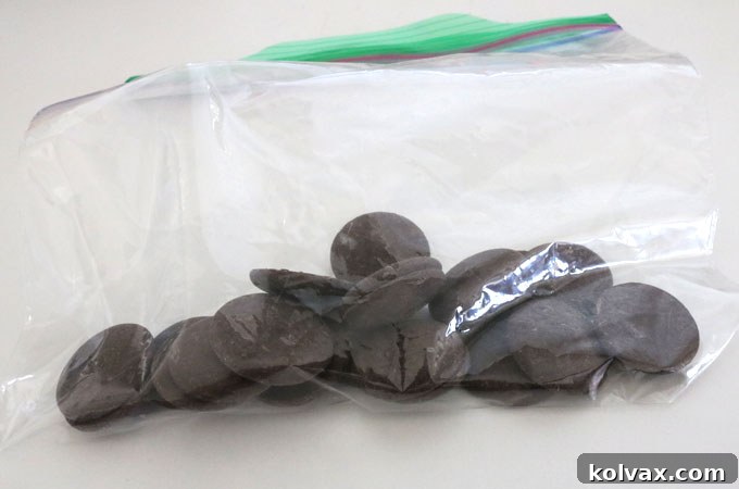 Chocolate drizzle being applied to the Patriotic Ice Cream Cookie Pizza