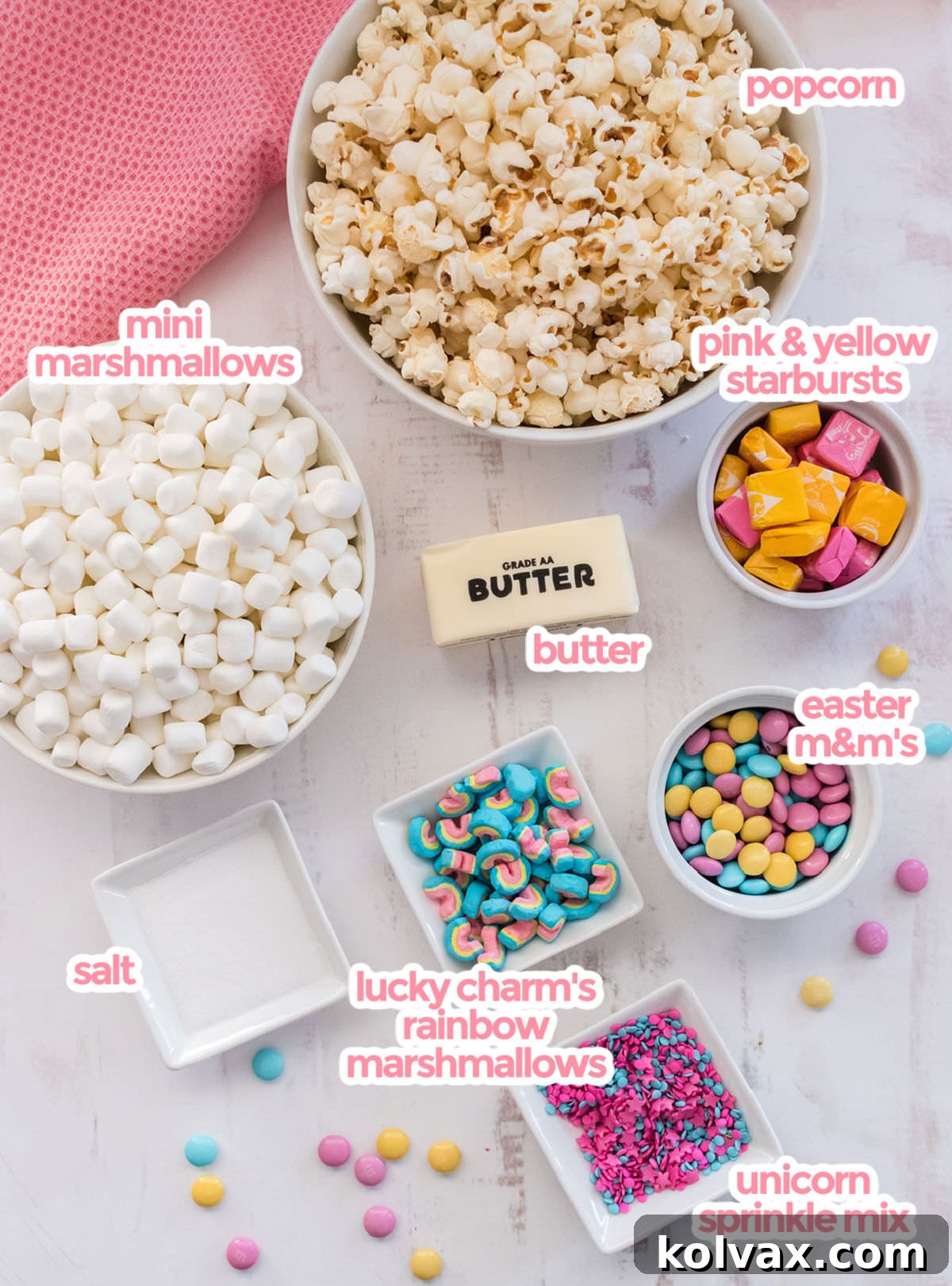 All the ingredients needs to make Unicorn Popcorn including popcorn,  marshmallows, starburst candies, butter, M&M's, sprinkles, rainbow marshmallows and salt. 