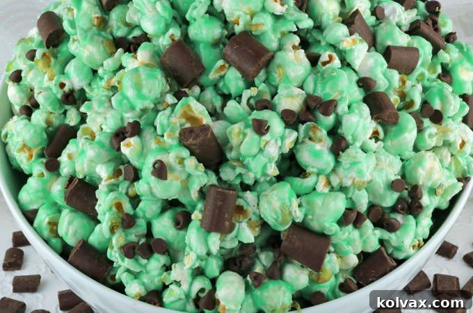 Delicious Chocolate Mint Popcorn: Sweet and salty popcorn covered in refreshing mint marshmallow and chocolate chips. The perfect snack for family movie nights or any time you crave a special treat!