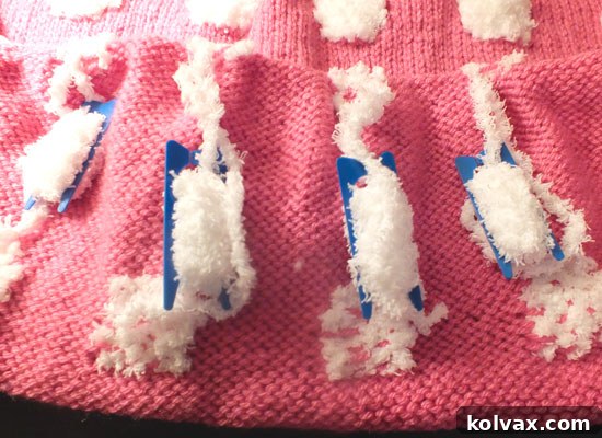 Yarn bobbins arranged for Intarsia knitting of sheep