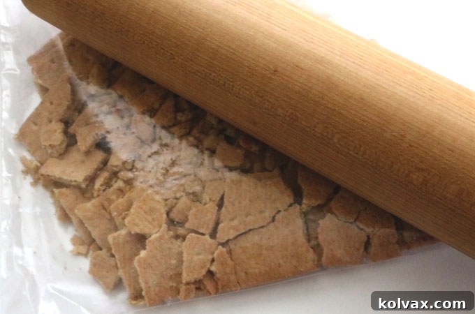 Full graham cracker sheets placed inside a clear plastic bag, ready to be crushed for the pie crust base.