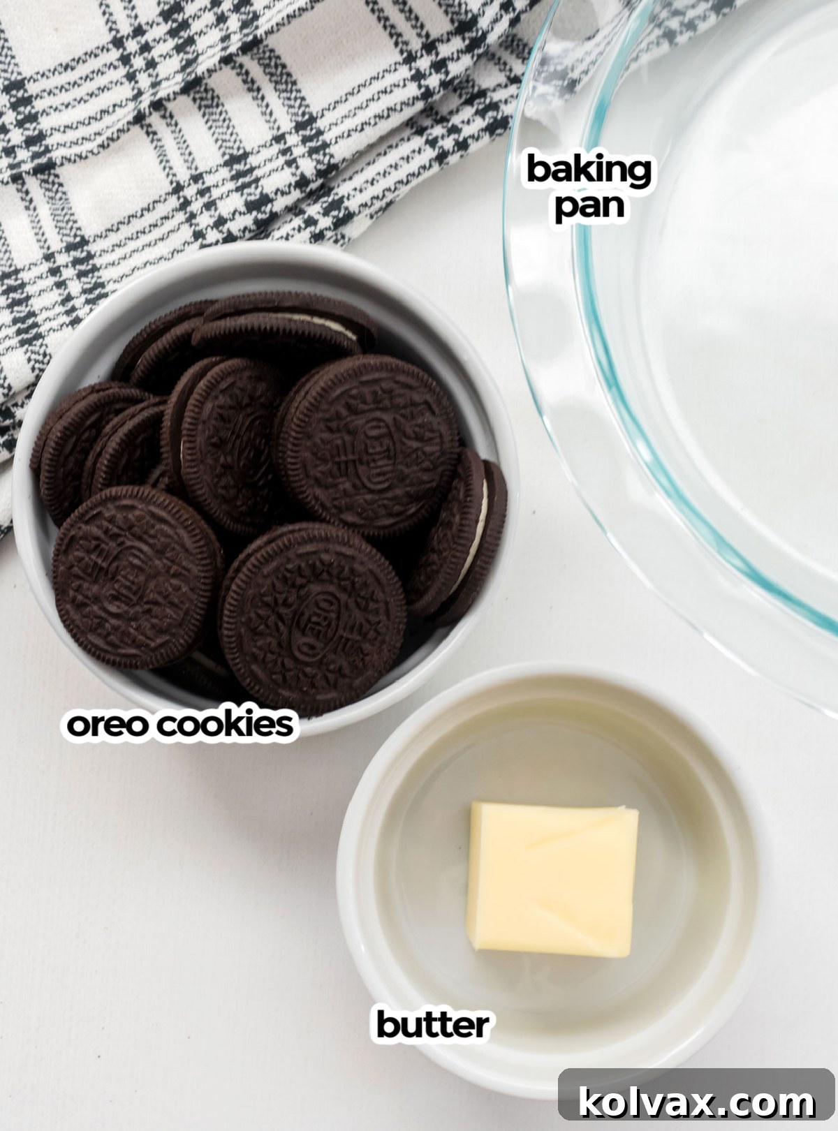 A visual guide to the minimal ingredients needed for an Oreo crust: a stack of Oreo cookies, a stick of melted butter, and a pie pan ready for preparation.