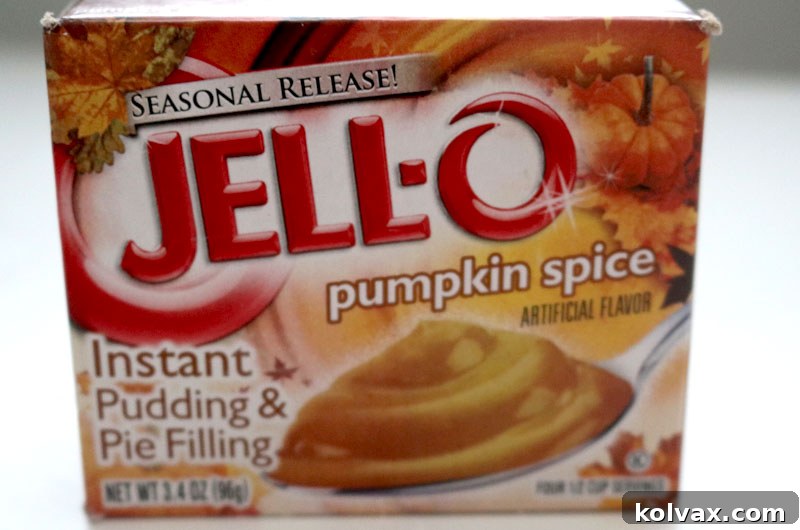 Close-up of a Jell-o Pumpkin Spice Instant Pudding mix box, highlighting the key ingredient for achieving stable and flavorful pumpkin spice frosting.