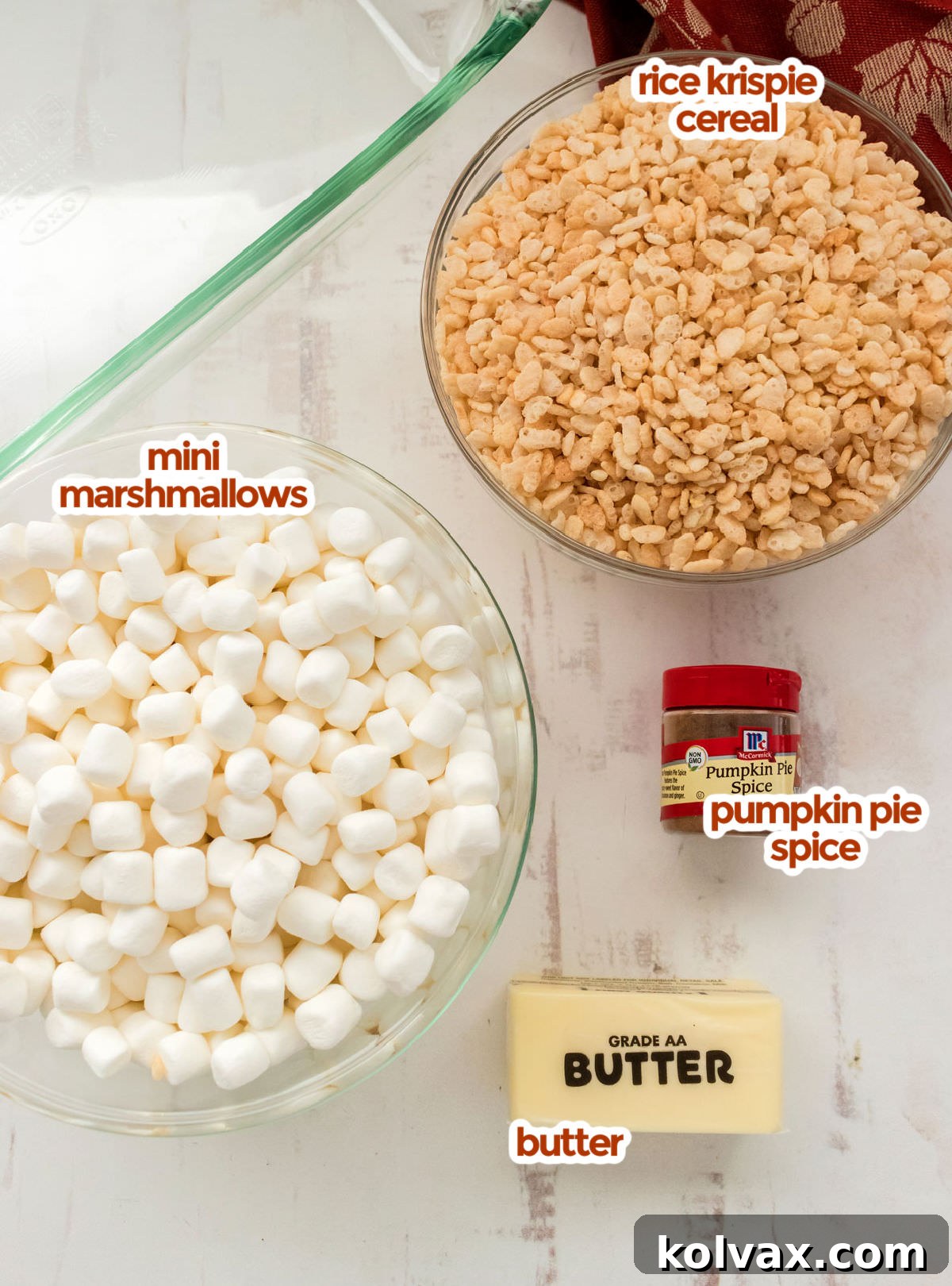 All the ingredients you will need to make Pumpkin Spice Rice Krispie Treats including Rice Krispie Cereal, Mini Marshmallows, Pumpkin Pie Spice and Butter.
