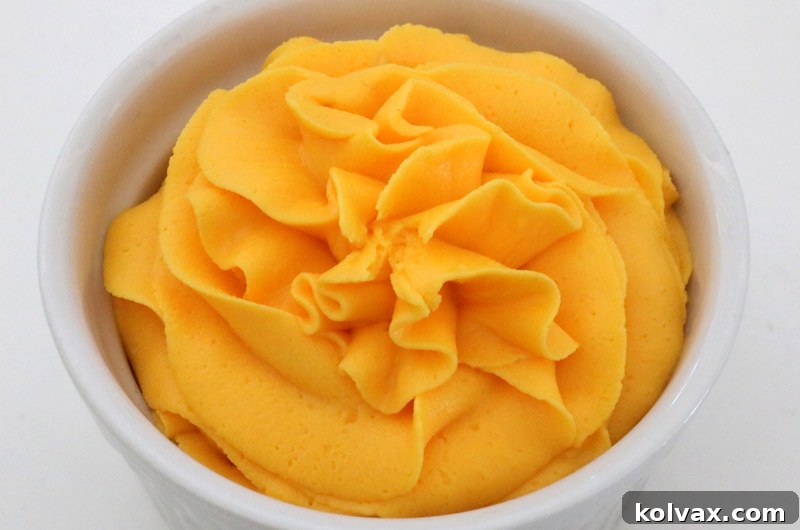 Create stunning Fall Harvest Gold Frosting with ease! Our simple formula uses yellow and orange food coloring to produce a radiant, elegant gold buttercream perfect for autumn celebrations. Add a touch of shimmer to your seasonal desserts.