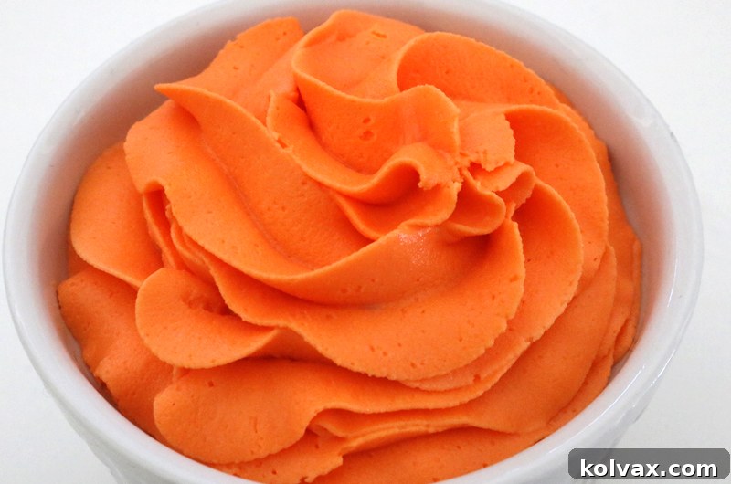 Craft the perfect Fall Harvest Orange Frosting for your autumn treats. Our tried-and-true formula combines orange, yellow, and red food coloring to create a rich, natural, and deep orange hue that stands out. Say goodbye to plain, artificial orange colors.