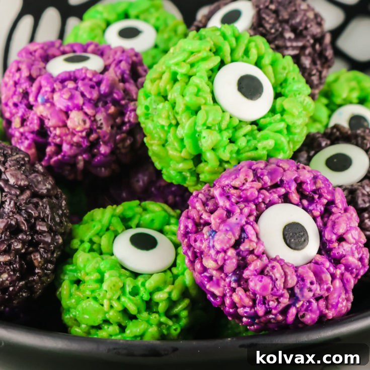 Monster Eye Balls Rice Krispie Bites - close-up of a festive Halloween treat with vibrant colors and candy eyes.