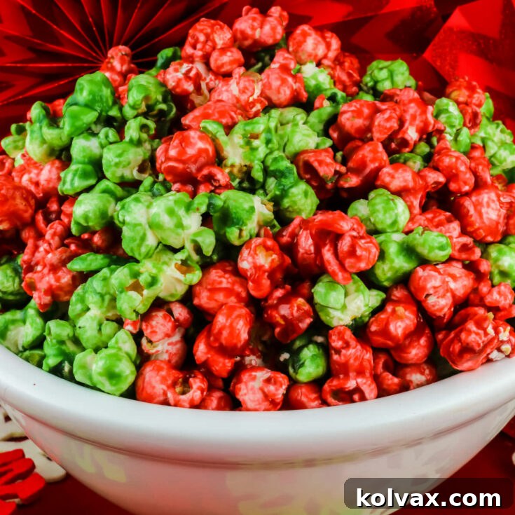 A festive image of the finished Christmas Caramel Corn, featuring bright red and green kernels mixed together.