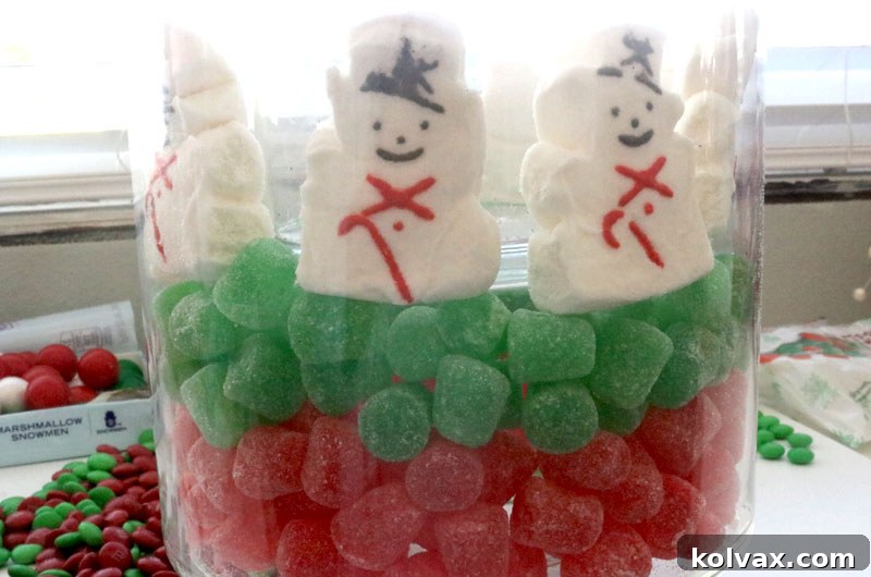 Adding an adorable layer of Christmas Peeps snowmen around the inner vase, creating a whimsical and unique candy layer.