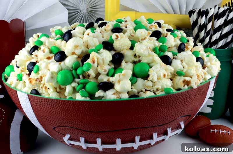 Philadelphia Eagles Popcorn - The Ultimate Game Day Snack for Dedicated Fans. Sweet, Salty, Crunchy, and incredibly easy to make. Perfect for your next NFL playoff party, Super Bowl gathering, or any game day celebration. Discover more exciting Super Bowl Food Ideas with us! #PhiladelphiaEagles #Eagles #SuperBowl #SuperBowlParty #SuperBowlFood #EaglesNation #GameDaySnacks #SweetTreats #NFLFootball