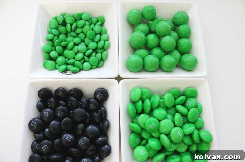 Assortment of green and black M&M's and pretzel M&M's for Philadelphia Eagles Popcorn.