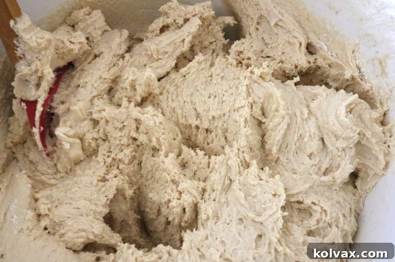 Cookie dough in a mixer bowl before coloring for Philadelphia Eagles cookies.