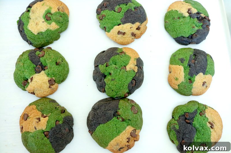 Freshly baked Philadelphia Eagles Chocolate Chip Cookies cooling on a rack after coming out of the oven.