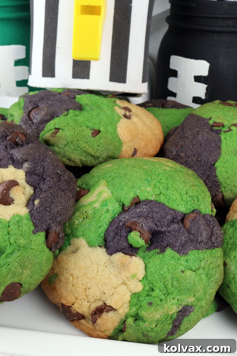 Stacked Philadelphia Eagles Chocolate Chip Cookies with green, black, and white swirls.