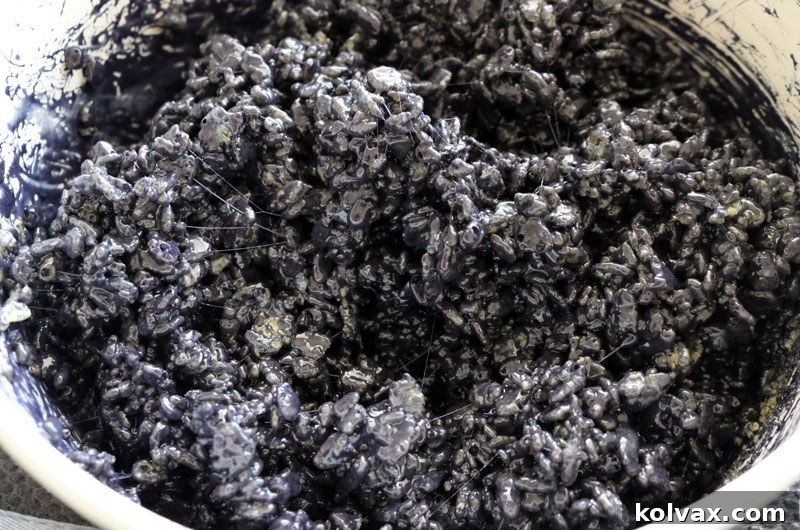 Black Rice Krispie Treats mixture, perfectly colored and ready for molding.