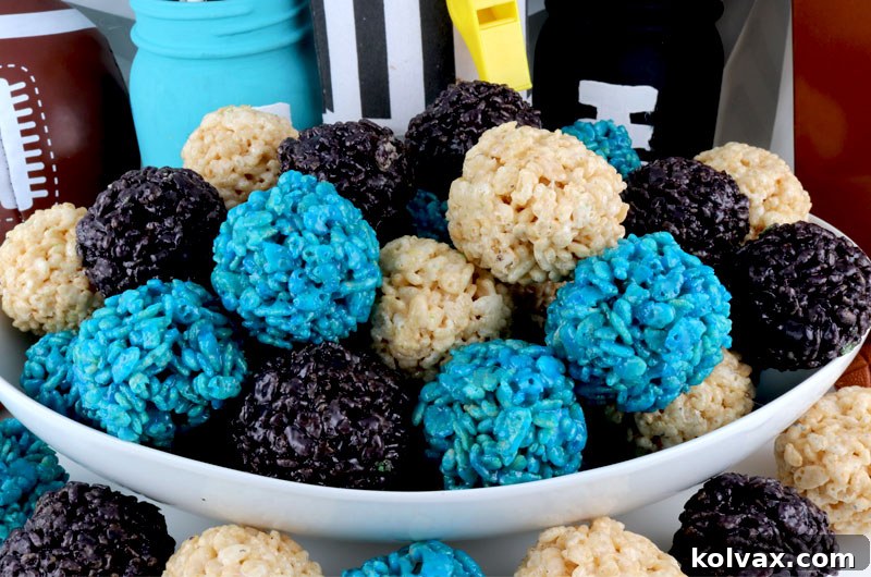 Jacksonville Jaguars Rice Krispie Bites - Yummy, bite-sized balls of crunchy, marshmallow-y delight. These colorful and festive Jacksonville Jaguars Treats are great for a game day football party, an NFL playoff party, a Super Bowl party or as a special snack for the Jacksonville Jaguars fans in your life. Go Jaguars! Follow us for more fun Super Bowl Food Ideas. #jaguars #jacksonvillejaguars #superbowlparty #superbowlfood #jacksonvillejaguarsfood