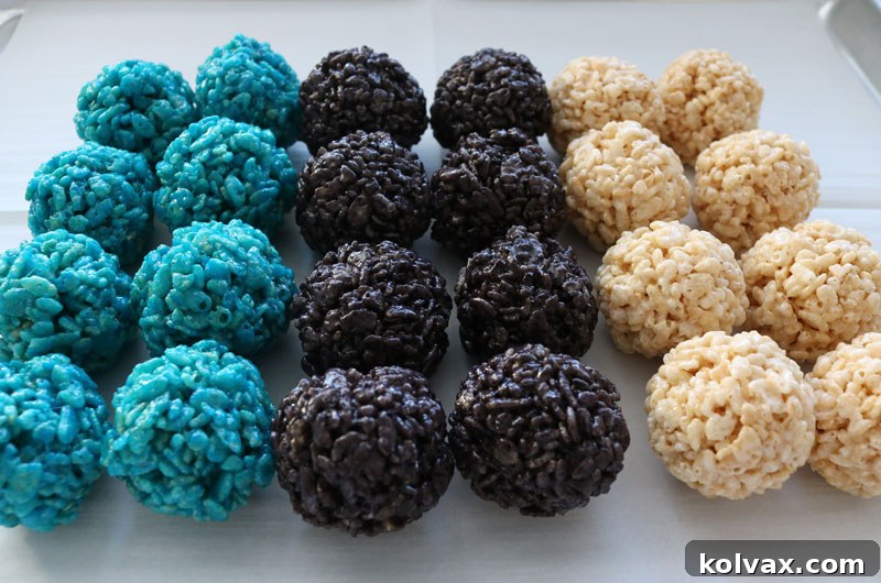 Jacksonville Jaguars Rice Krispie Bites - Yummy, bite-sized balls of crunchy, marshmallow-y delight. These colorful and festive Jacksonville Jaguars Treats are great for a game day football party, an NFL playoff party, a Super Bowl party or as a special snack for the Jacksonville Jaguars fans in your life. Go Jaguars! Follow us for more fun Super Bowl Food Ideas. #jaguars #jacksonvillejaguars #superbowlparty #superbowlfood #jacksonvillejaguarsfood