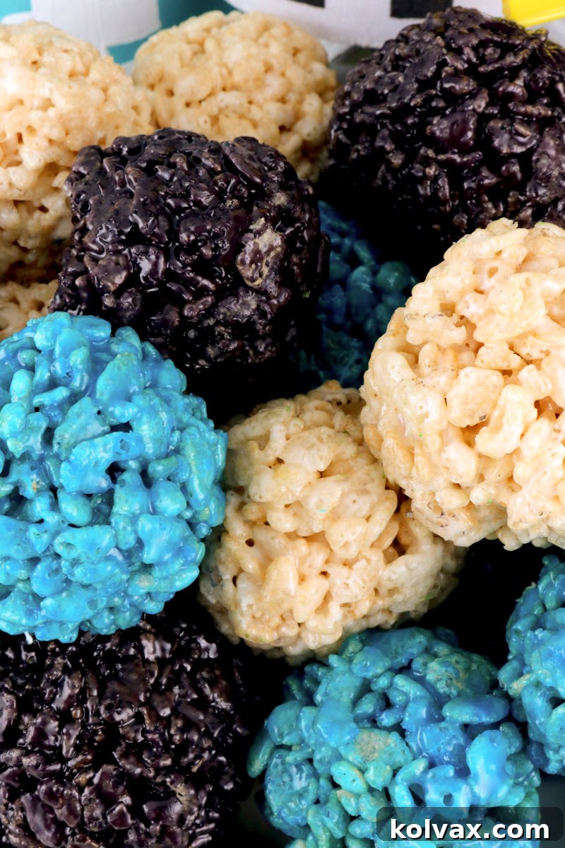 Jacksonville Jaguars Rice Krispie Bites - Yummy, bite-sized balls of crunchy, marshmallow-y delight. These colorful and festive Jacksonville Jaguars Treats are great for a game day football party, an NFL playoff party, a Super Bowl party or as a special snack for the Jacksonville Jaguars fans in your life. Go Jaguars! Follow us for more fun Super Bowl Food Ideas. #jaguars #jacksonvillejaguars #superbowlparty #superbowlfood #jacksonvillejaguarsfood