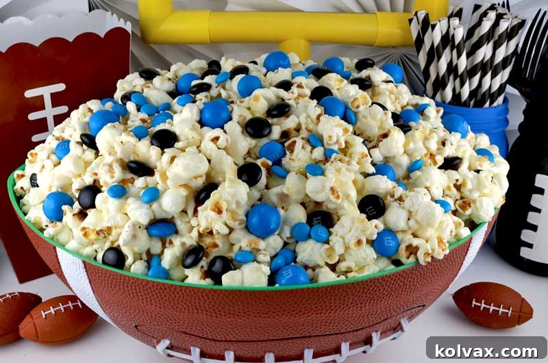 Delicious Jacksonville Jaguars popcorn, a perfect sweet and salty snack for game day. Enjoy crunchy popcorn with marshmallow coating and team-colored M&Ms at your next NFL playoff or Super Bowl party.